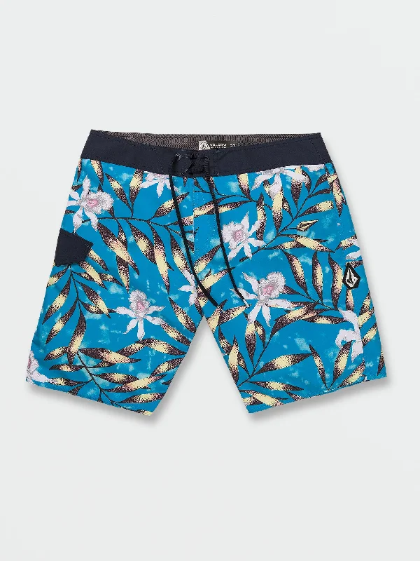 Men's eco-conscious travel shorts-Tropical Hideout Mod-Tech Trunks - Maliblue